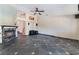 Spacious living room boasts a fireplace, stylish tile flooring, and a ceiling fan for added comfort at 10024 Skipper Ct, Las Vegas, NV 89117