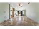 Expansive living room showcasing neutral walls, tile flooring, a fireplace, and natural light from sliding glass doors at 10024 Skipper Ct, Las Vegas, NV 89117
