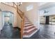 Elegant staircase with tile accents and views of adjacent living spaces at 10024 Skipper Ct, Las Vegas, NV 89117