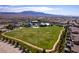 Aerial view showcasing the community sports field with soccer goals, adjacent to the amenity center at 10196 Millholm Ave, Las Vegas, NV 89166