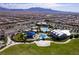 Mountain view of community featuring aquatic area, sports fields, recreational area, and clubhouse amenities at 10196 Millholm Ave, Las Vegas, NV 89166