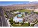 Community aerial featuring recreation area with sports fields, aquatic area, and amenity center at 10196 Millholm Ave, Las Vegas, NV 89166