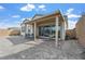 A spacious backyard patio features a covered seating area perfect for outdoor entertaining at 10196 Millholm Ave, Las Vegas, NV 89166