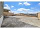 Wide-open backyard with low-maintenance gravel, ideal for customization and outdoor living at 10196 Millholm Ave, Las Vegas, NV 89166