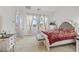 Comfortable bedroom with carpet, neutral colors, and views of the outdoors at 10196 Millholm Ave, Las Vegas, NV 89166