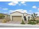 Charming single-story home featuring desert landscaping and a two-car garage at 10196 Millholm Ave, Las Vegas, NV 89166