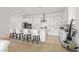 Modern kitchen with white cabinets, stainless steel appliances, and a large island at 10196 Millholm Ave, Las Vegas, NV 89166