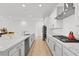 Modern kitchen with white cabinets, stainless steel appliances, and a large island at 10196 Millholm Ave, Las Vegas, NV 89166