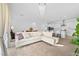 Bright, open living space with modern furniture and a seamless flow into the kitchen at 10196 Millholm Ave, Las Vegas, NV 89166