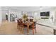 Open floor plan combines kitchen and living room, accented by stylish furnishings and natural light at 10196 Millholm Ave, Las Vegas, NV 89166