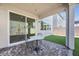 Outdoor patio area with covered roof and artificial grass for low maintenance at 10214 Natural Anchor St, Las Vegas, NV 89166