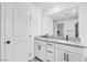 Bathroom featuring double sinks with grey countertops and white cabinets beneath at 10214 Natural Anchor St, Las Vegas, NV 89166