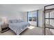 Comfortable bedroom with a bed and window showcasing neighborhood views at 10214 Natural Anchor St, Las Vegas, NV 89166