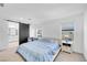 Bright bedroom featuring a modern bed with a barn door leading to closet at 10214 Natural Anchor St, Las Vegas, NV 89166
