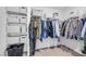 Walk-in closet featuring wire shelving with organized boxes and hanging clothes at 10214 Natural Anchor St, Las Vegas, NV 89166