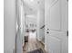 Bright entryway with hardwood floors, a staircase, and a view into the living area at 10214 Natural Anchor St, Las Vegas, NV 89166