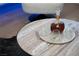 Close up of table with decanter, glasses, and refreshments at 10261 Largo Sassetta Ct, Las Vegas, NV 89135