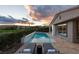 Inviting backyard pool with lounge chairs for relaxing at 10261 Largo Sassetta Ct, Las Vegas, NV 89135