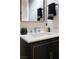 Stylish bathroom vanity with marble countertop, modern faucet, and elegant decor at 10261 Largo Sassetta Ct, Las Vegas, NV 89135