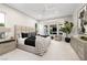 Serene bedroom with bay window, stylish furniture, and sophisticated decor creates a peaceful retreat at 10261 Largo Sassetta Ct, Las Vegas, NV 89135