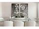 Close up on dining table showcasing elegant decor, modern lighting, and neutral color palette at 10261 Largo Sassetta Ct, Las Vegas, NV 89135