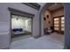 Versatile garage with open door, showcasing a flexible space, ideal for a gym or hobby area at 10261 Largo Sassetta Ct, Las Vegas, NV 89135