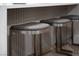 Stylish kitchen island with seating featuring elegant design and modern finishes at 10261 Largo Sassetta Ct, Las Vegas, NV 89135