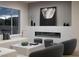 Beautiful living room with elegant fireplace, stylish decor, and natural light at 10261 Largo Sassetta Ct, Las Vegas, NV 89135