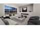 Modern living room features sleek fireplace, contemporary furnishings, and ample natural light at 10261 Largo Sassetta Ct, Las Vegas, NV 89135