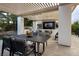 Inviting outdoor area with covered dining and barbecue space at 10261 Largo Sassetta Ct, Las Vegas, NV 89135