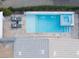 Aerial view of a stunning pool and spa combination, complemented by elegant patio and landscaping at 10261 Largo Sassetta Ct, Las Vegas, NV 89135