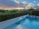 Backyard pool with spa and greenery, showcasing tranquil outdoor living at 10261 Largo Sassetta Ct, Las Vegas, NV 89135