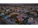 Aerial shot of a residential neighborhood featuring single-Gathering homes, desert landscaping, and a community pool at 10524 Longwood Dr, Las Vegas, NV 89134
