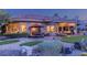 Backyard featuring desert landscaping, a patio with ample seating, and a well-manicured lawn at 10524 Longwood Dr, Las Vegas, NV 89134