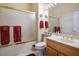 Bathroom featuring vanity, toilet, mirror, and glass shower with gold trim at 10524 Longwood Dr, Las Vegas, NV 89134