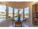 Charming breakfast nook with chandelier and golf course view at 10524 Longwood Dr, Las Vegas, NV 89134