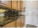 Granite countertop in butler's pantry with a wine rack at 10524 Longwood Dr, Las Vegas, NV 89134