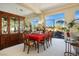 Formal dining area featuring a wooden hutch, a table set for six, and natural light at 10524 Longwood Dr, Las Vegas, NV 89134
