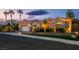 Exterior view of a home showcasing its facade, landscaping, and lighting at twilight at 10524 Longwood Dr, Las Vegas, NV 89134