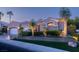Beautiful single-story home with desert landscaping, a three-car garage, and a stone facade at 10524 Longwood Dr, Las Vegas, NV 89134