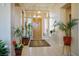 Welcoming foyer with tile flooring, high ceilings, and decorative plants at 10524 Longwood Dr, Las Vegas, NV 89134