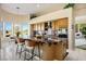 Spacious kitchen with a large island, marble countertops, and modern appliances at 10524 Longwood Dr, Las Vegas, NV 89134