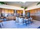 Bright kitchen with stainless steel appliances, wooden cabinets, and a center island with bar stools at 10524 Longwood Dr, Las Vegas, NV 89134