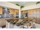 Gourmet kitchen featuring an island with seating, stainless steel appliances, and tiled backsplash at 10524 Longwood Dr, Las Vegas, NV 89134