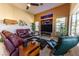 Spacious living room with high ceilings, recessed lights, fireplace, and modern decor at 10524 Longwood Dr, Las Vegas, NV 89134