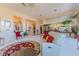 Spacious living room with a view of the backyard, decorative rug and an open floor plan at 10524 Longwood Dr, Las Vegas, NV 89134