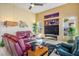 Elegant living room featuring a large TV, fireplace, modern decor, and comfortable seating at 10524 Longwood Dr, Las Vegas, NV 89134