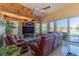 Inviting living room with high ceilings, fireplace, large windows, and comfortable seating at 10524 Longwood Dr, Las Vegas, NV 89134