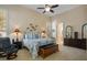 Serene main bedroom with neutral tones, a ceiling fan, and shuttered windows for abundant natural light at 10524 Longwood Dr, Las Vegas, NV 89134