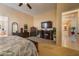 Expansive main bedroom with elegant furnishings, fireplace, and a view of the en-suite bath at 10524 Longwood Dr, Las Vegas, NV 89134
